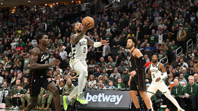 Milwaukee Bucks guard Damian Lillard (0) drives to the basket against the Detroit Pistons